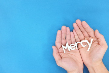 Open hands praying for mercy. Covid-19 coronavirus pandemic crisis.