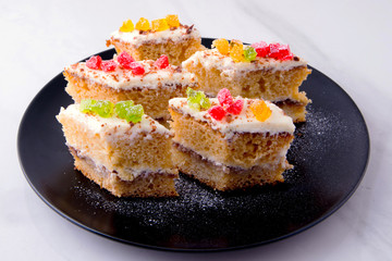 Cake on a black plate close-up