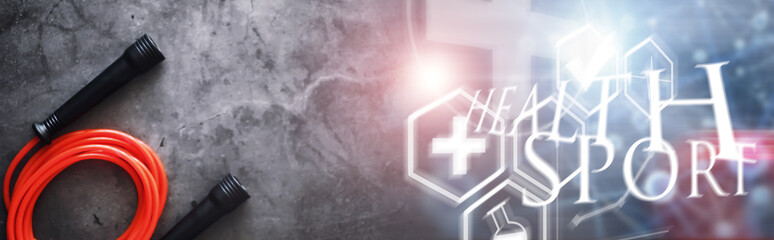 Jump rope. Physical education. Sports exercise equipment. Rope exercises routine. Pink jump rope phone with a stopwatch and water on the table.