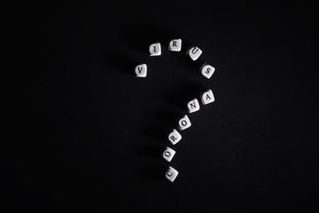 Small letters cubes the inscription "virus". On a dark background coronavirus. Director of the virus and coronavirus. World pandemic background.