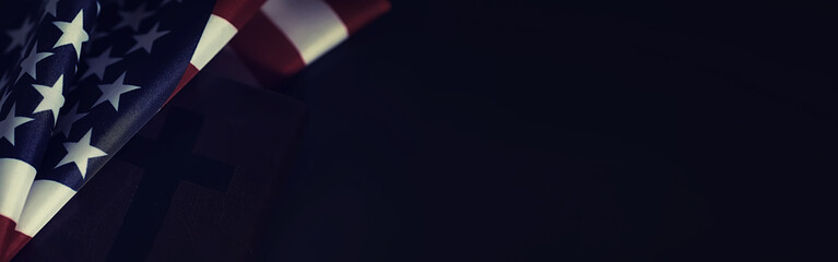 American flag and holy bible book on a mirror background. Symbol of the United States and religion....