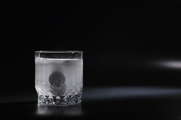 Water soluble tablets. The medicine is soluble. Anti-hangover. Effervescent tablets in a glass.