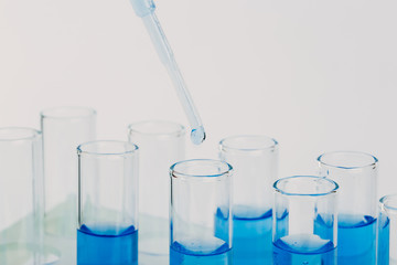 A pipette that adds fluid to one of several tubes. Lab tests