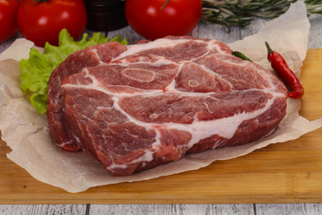 Raw pork neck steak