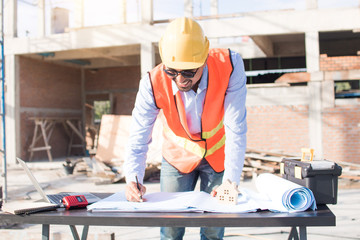 Engineer or inspector checking progressing work in construction site