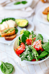 Akavado with cherry tomatoes, mozzarella, basil with olive oil. Healthy food. Selective focus. Vegetarian food