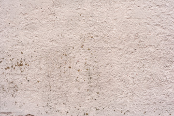 Texture of a concrete wall with cracks and scratches which can be used as a background