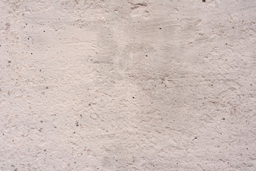 Texture of a concrete wall with cracks and scratches which can be used as a background