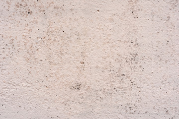 Texture of a concrete wall with cracks and scratches which can be used as a background