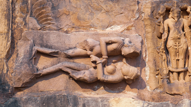 Stone carved erotic bas-relief Sculpture of love making in Kandariya Mahadeva Temple, Group of Monuments, India