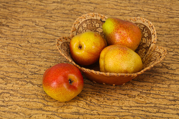 Pear heap in the wooden basket