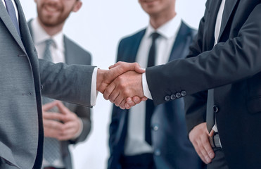 successful business partners shaking hands
