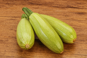Young tasty zucchini over board