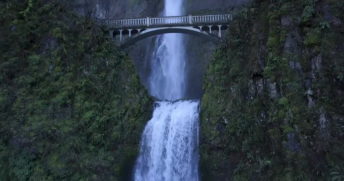 Waterfall Multnomah Falls 4K Aerial Drone - At bottom of falls fly under bridge from waterfall to the next