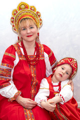 Family, girl and child girl in Russian national costume sundress and kokoshnik. National traditions and culture