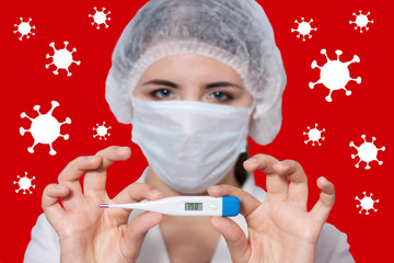 Female doctor in a medical mask holds an electronic thermometer, image of a coronavirus. High...