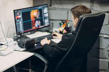 Stay home. Working home. Programmer with virtual reality headset, VR glasses with joystick with personal computer.