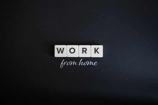 Freelancing and work from home concept. Block letters and cursive font on black background. Minimal Aesthetics.