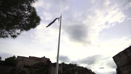 greece meteora monastery timelapse clouds flag  tree - Powered by Adobe