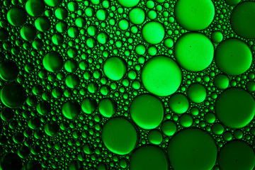Abstract Green water and oil bubbles background. Green Water Drops Background close up . Macro shot