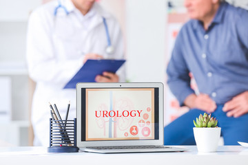 Modern laptop on table in urologist's office