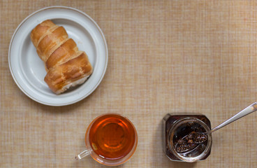 dessert table, pastry tube with tea and jam from cones