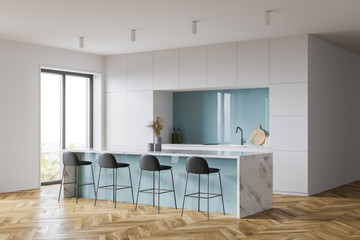 White and blue kitchen corner with bar and window