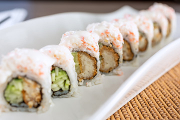 A view of a snow mountain roll in a restaurant or kitchen setting.