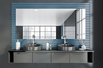 Double sink in gray and blue bathroom