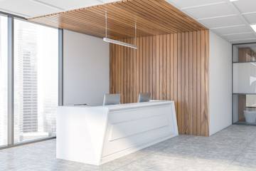 Reception desk in white and wooden office corner