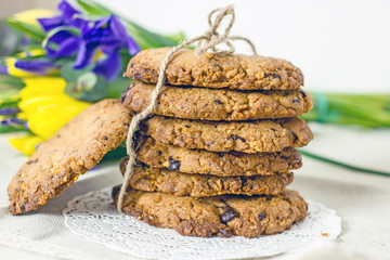 Round homemade cookies with chocolate on the table close-up. Delicious homemade cakes with chocolate chips and cornflakes