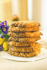 Round homemade cookies with chocolate on the table close-up. Delicious homemade cakes with chocolate chips and cornflakes
