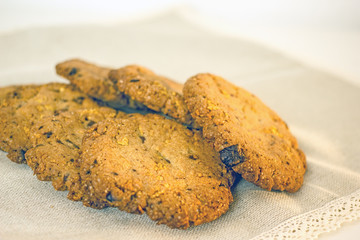 Round homemade cookies with chocolate on the table close-up. Delicious homemade cakes with chocolate chips and cornflakes