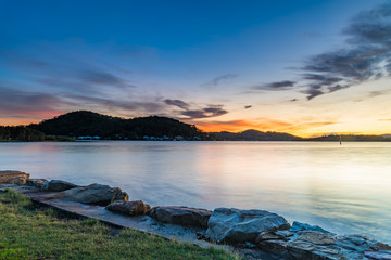 Fototapeta premium Sunrise Waterscape over the Bay with High Clouds