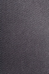 Simple black / grey dark plastic synthetic textile material surface background texture, waterproof, non natural fiber woven abstract backdrop Detail, closeup, minimalistic macro shot detailed textiles