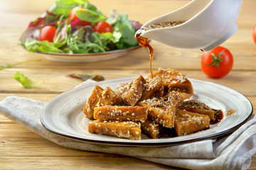 grilled halloumi cheese with sauce and salad