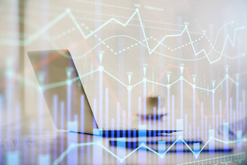 Multi exposure of graph and financial info and work space with computer background. Concept of international online trading.