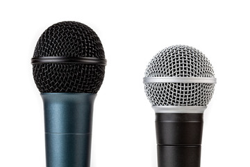 Pair of simple vocal microphones, mic grills closeup shot, objects isolated on white, cut out....