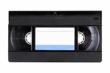 Old black vintage vhs cassette tape front with a blank paper label, front side, top view isolated on white, cut out 80s, 90s retro media aesthetic, magnetic videotape movie storage concept studio shot