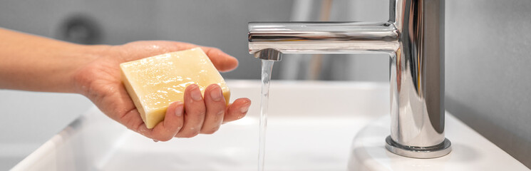Corona virus washing hands with soap bar at home COVID-19 prevention. Hand hygiene for coronavirus...