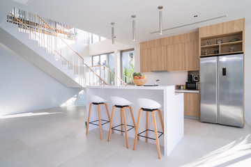 Interior design of pool villa, house, home, condo and apartment feature round stool, kitchen counter and kitchenette