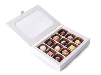 Box with delicious chocolate candies on white background