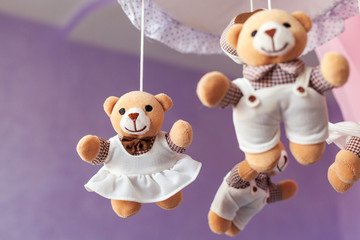 Baby music mobile carousel with little bears. Toy carousel, above the baby bed. Baby bedroom close...