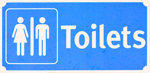 Restroom sign on a toilet door,on white 
 background.Toilet sign - Restroom Concept - blue tone.WC / Toilet icons set. Men and women WC signs for restroom.