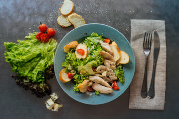 Healthy  Fresh Spring Grilled Chicken Caesar Salad with dor blue Cheese and Croutons. Top view