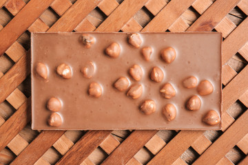 Sweet chocolate with nuts on table