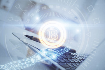 Multi exposure of blockchain and crypto economy theme hologram and table with computer background. Concept of bitcoin cryptocurrency.