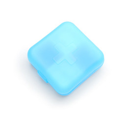 Container with pills on white background