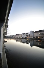 river limmat in zurich switzerland in the morning with old houses facade