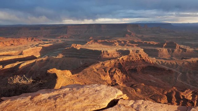 Sunset view of Dead Horse Point State Park, Utah, USA. Сamera moves over a cliff, view of canyon and colorado river. Steadicam shot, 4K